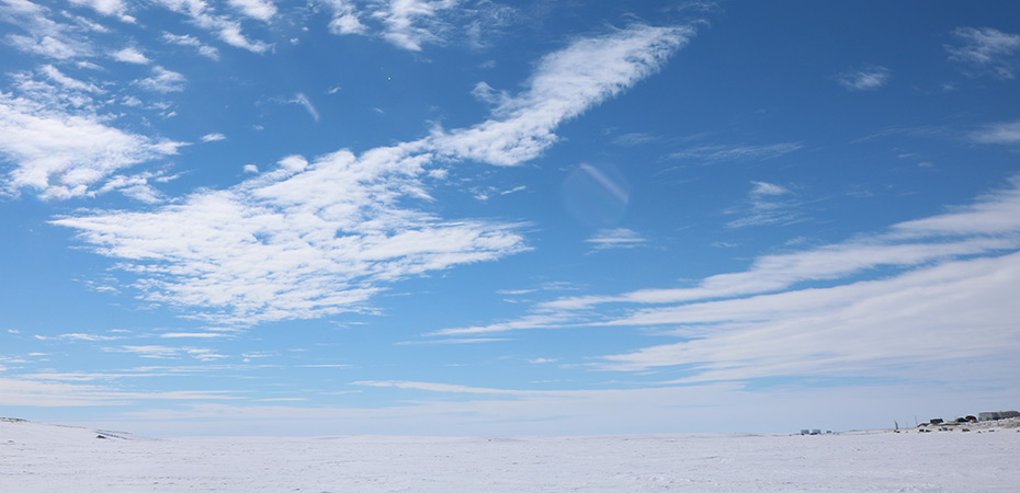 wide view of snow field and beautiful sky