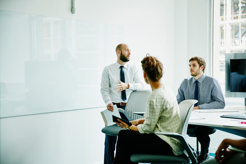 Businessman leading project discussion during meeting in conference room