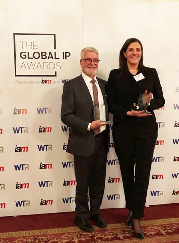 Photograph of Scott Jolliffe and Monique Couture wth the Russia - IP Firm of the year award trophy