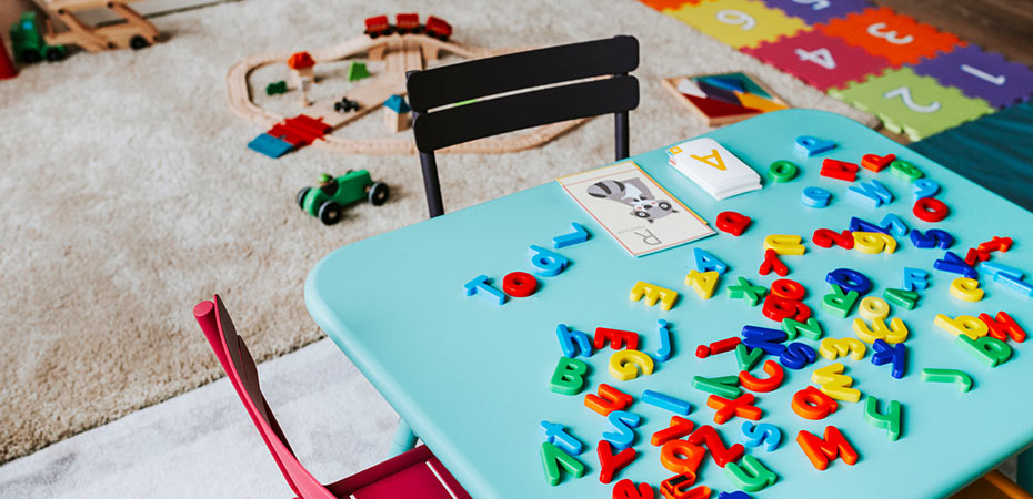 daycare center with alphabet toys on table
